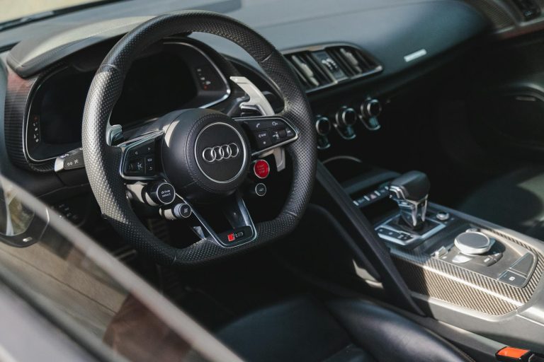 luxury car interior featuring audi steering wheel
